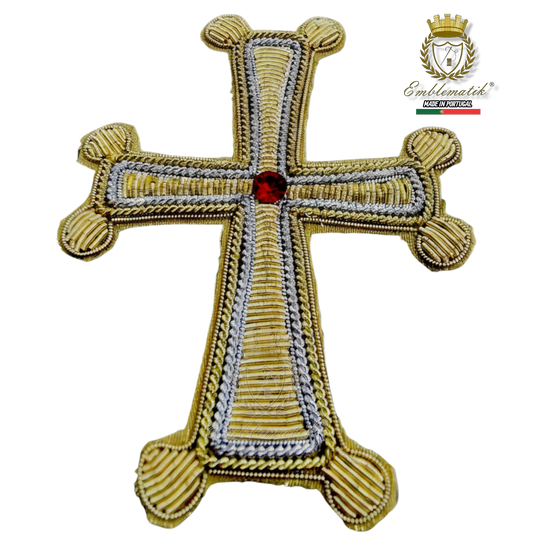 Emblematik by Pasamanerias y Bordados handmade embroidered bullion cross with red gemstone center.