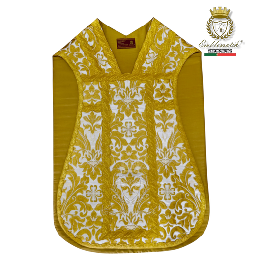Emblematik by Pasamanerias y Bordados gold and white Roman chasuble vestment set with ornate damask pattern.