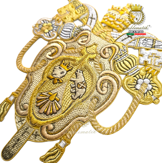 Emblematik by Pasamanerias y Bordados Papal Coat of Arms of Benedict XVI, gold and silver metallic thread embroidery.
