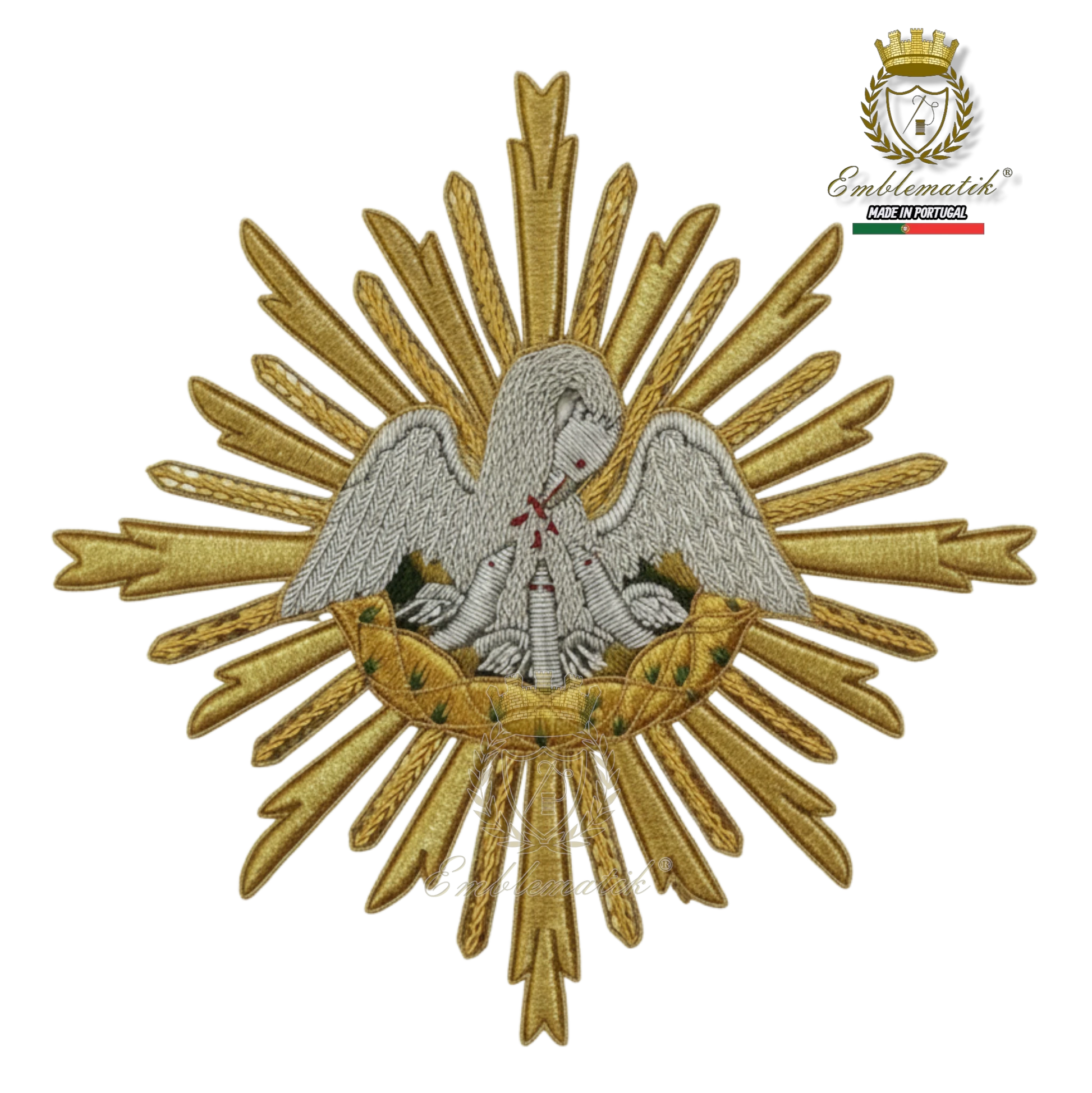 Emblematik by Pasamanerias y Bordados gold and silver metallic pelican emblem with intricate details, hand-made for liturgical vestments.