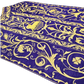 Emblematik by Pasamanerias y Bordados Roman Chasuble in purple with metallic gold embroidery of floral patterns and Agnus Dei.