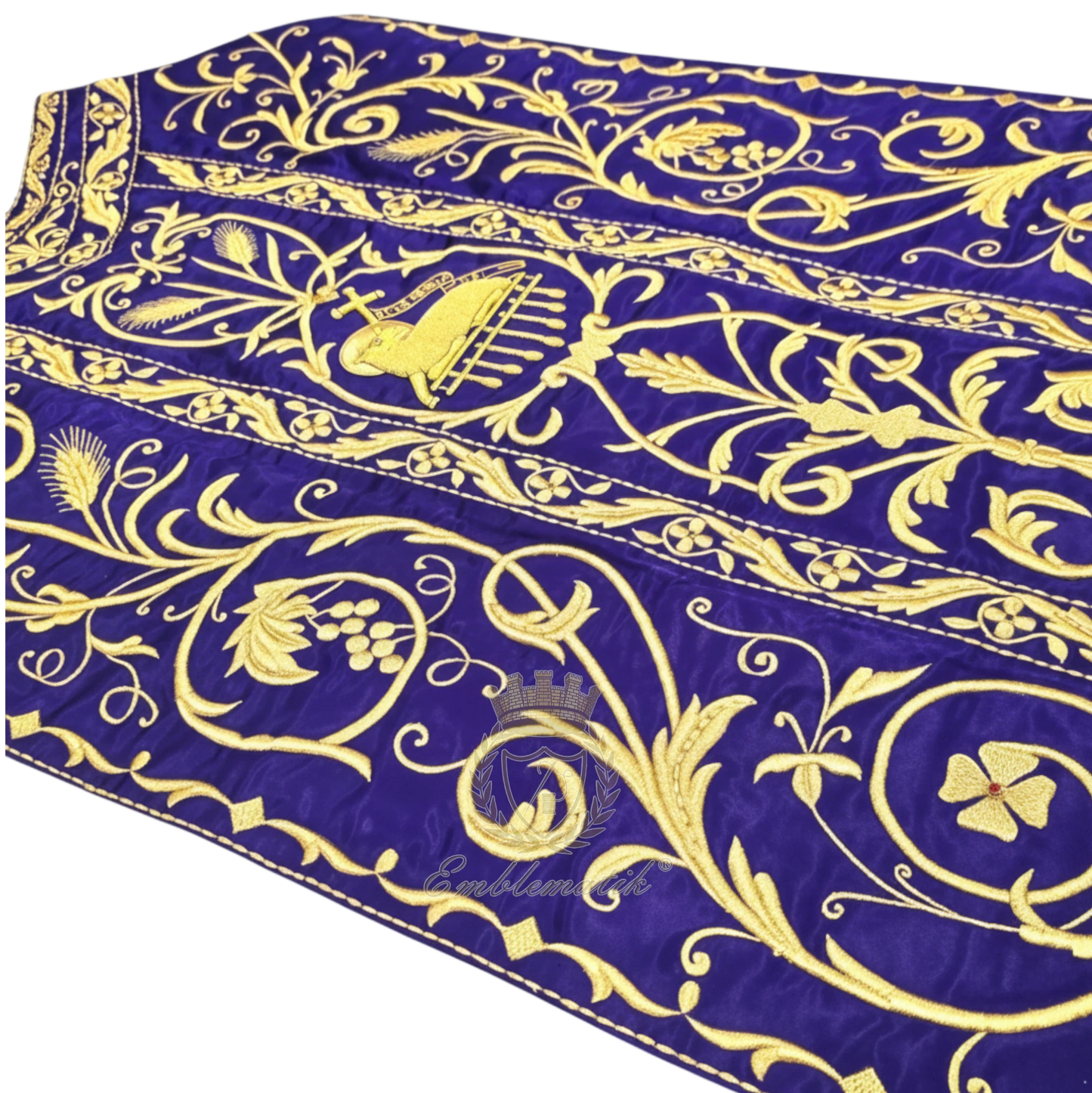 Emblematik by Pasamanerias y Bordados Roman Chasuble in purple with metallic gold embroidery of floral patterns and Agnus Dei.