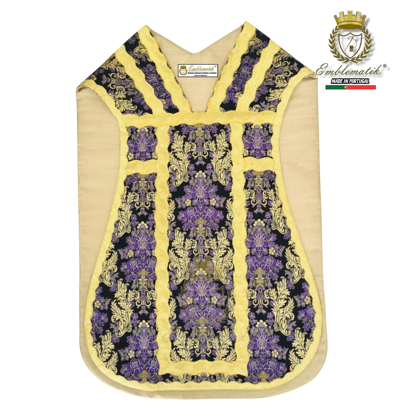 Emblematik by Pasamanerias y Bordados purple floral metallic brocade Roman chasuble with gold trim.