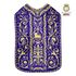 Emblematik by Pasamanerias y Bordados purple metallic embroidered Roman chasuble with Agnus Dei motif.