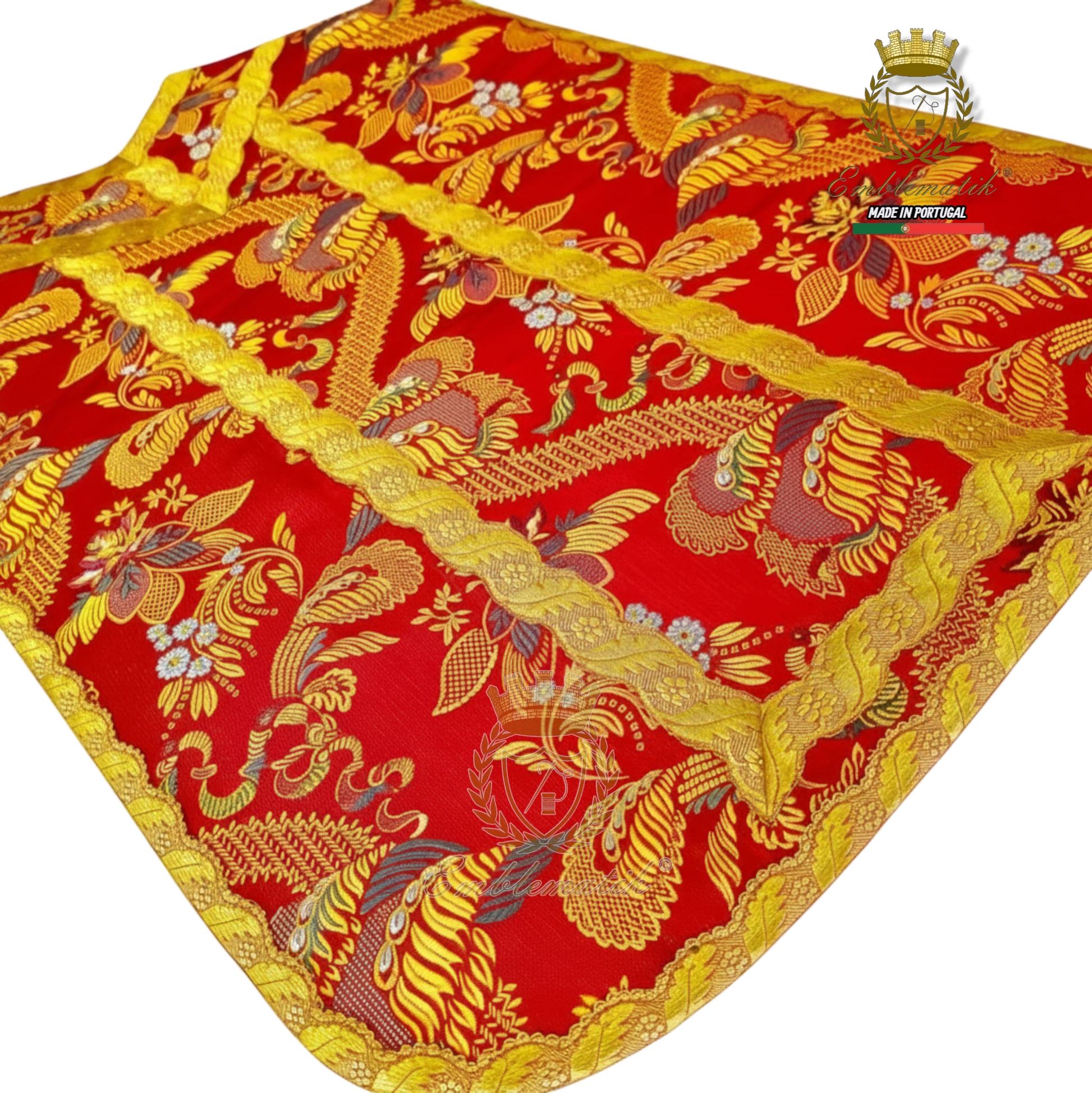 Emblematik by Pasamanerias y Bordados red Roman vestment low mass set with gold trim and intricate peacock and floral patterns.